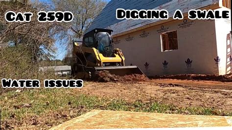 swale trench cleanup with skid steer|Question on digging swales .